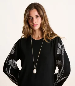 Gouden halsketting met witte natuursteen