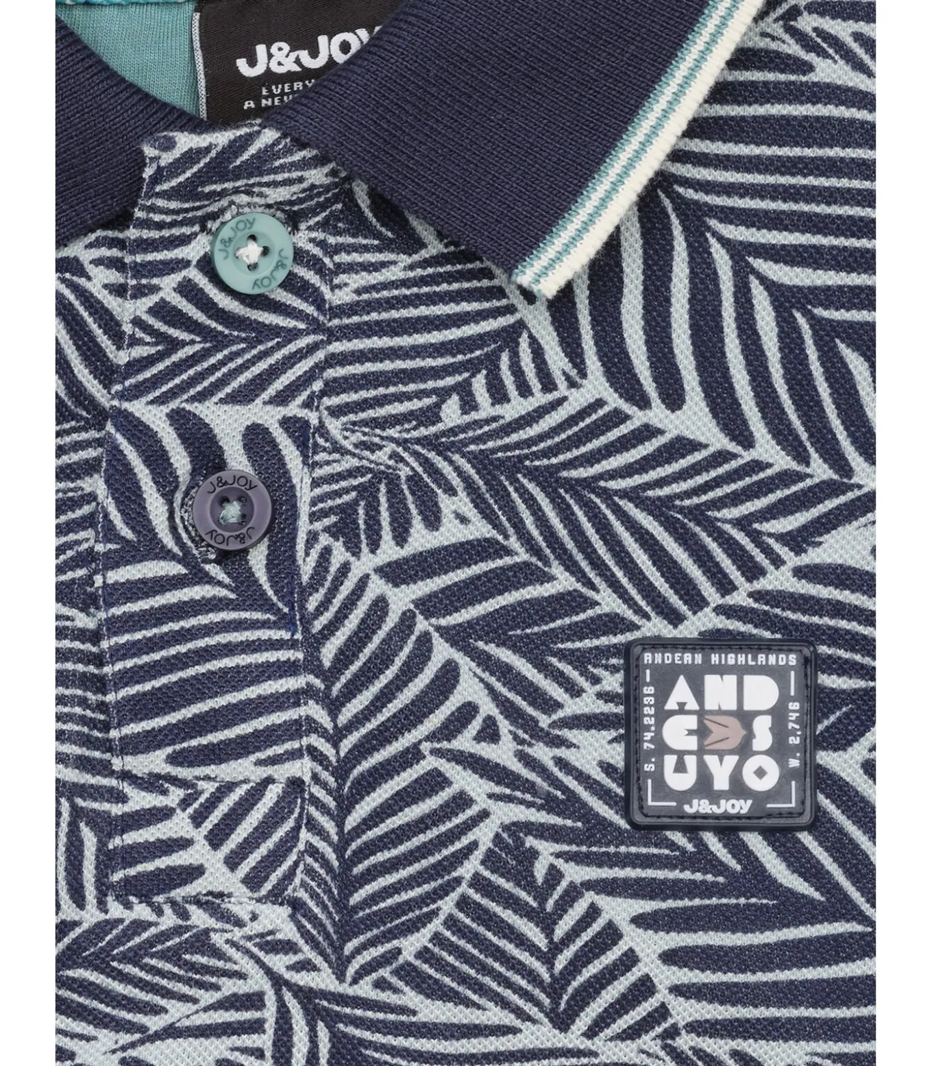 Jongens wit en blauw poloshirt met plantenprint